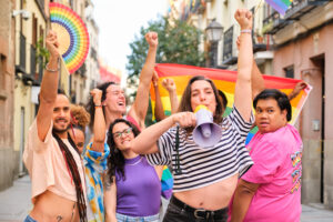 lgbtq people with rainbow flags and a megaphone fi 2024 04 02 21 05 49 utc