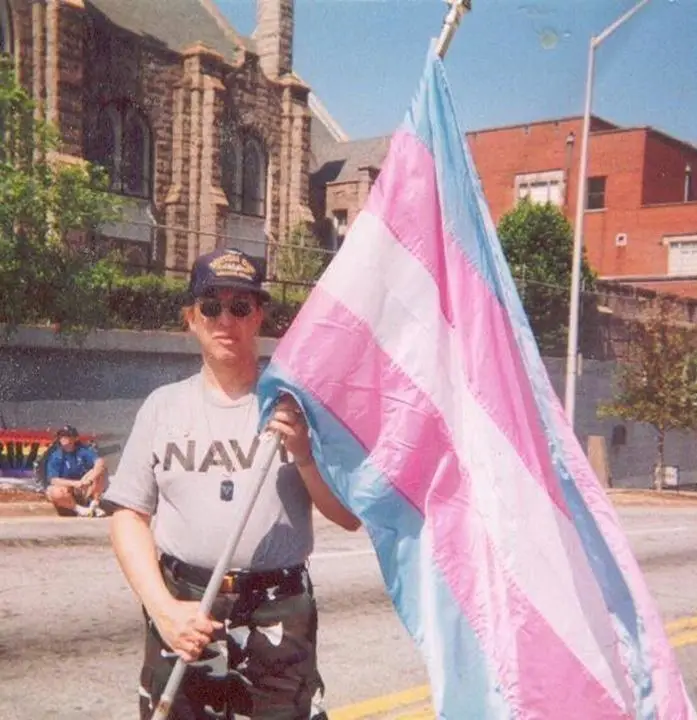 Monica Helms holding the transgender flag