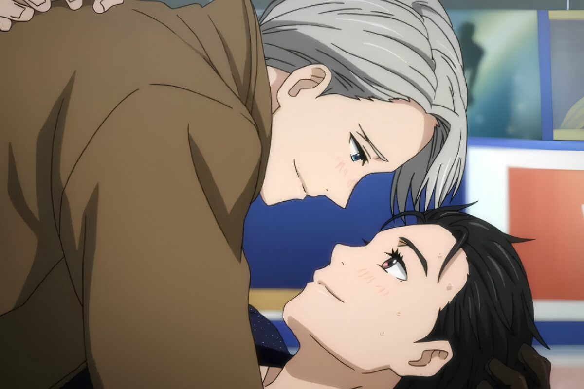 Yuri Katsuki, below, smiles as he is embraced by Victor Nikiforov, above, on an ice rink