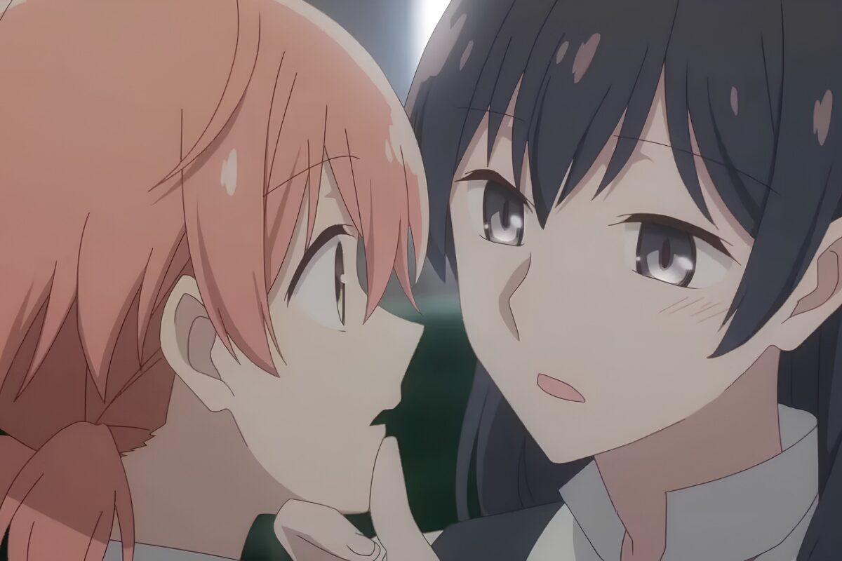 Touko Nanami, right, stares into Yuu Koito’s eyes while gently pressing her thumb against Yuu’s chin
