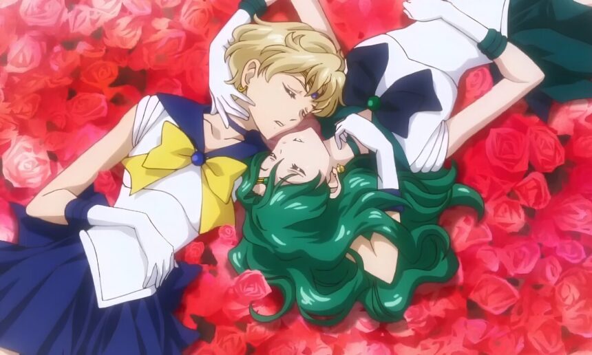 Haruka Tenoh, left and Michiru Kaioh, AKA Sailor Uranus and Sailor Neptune, lie inverted to one another on a bed if roses, face to face, eyes closed