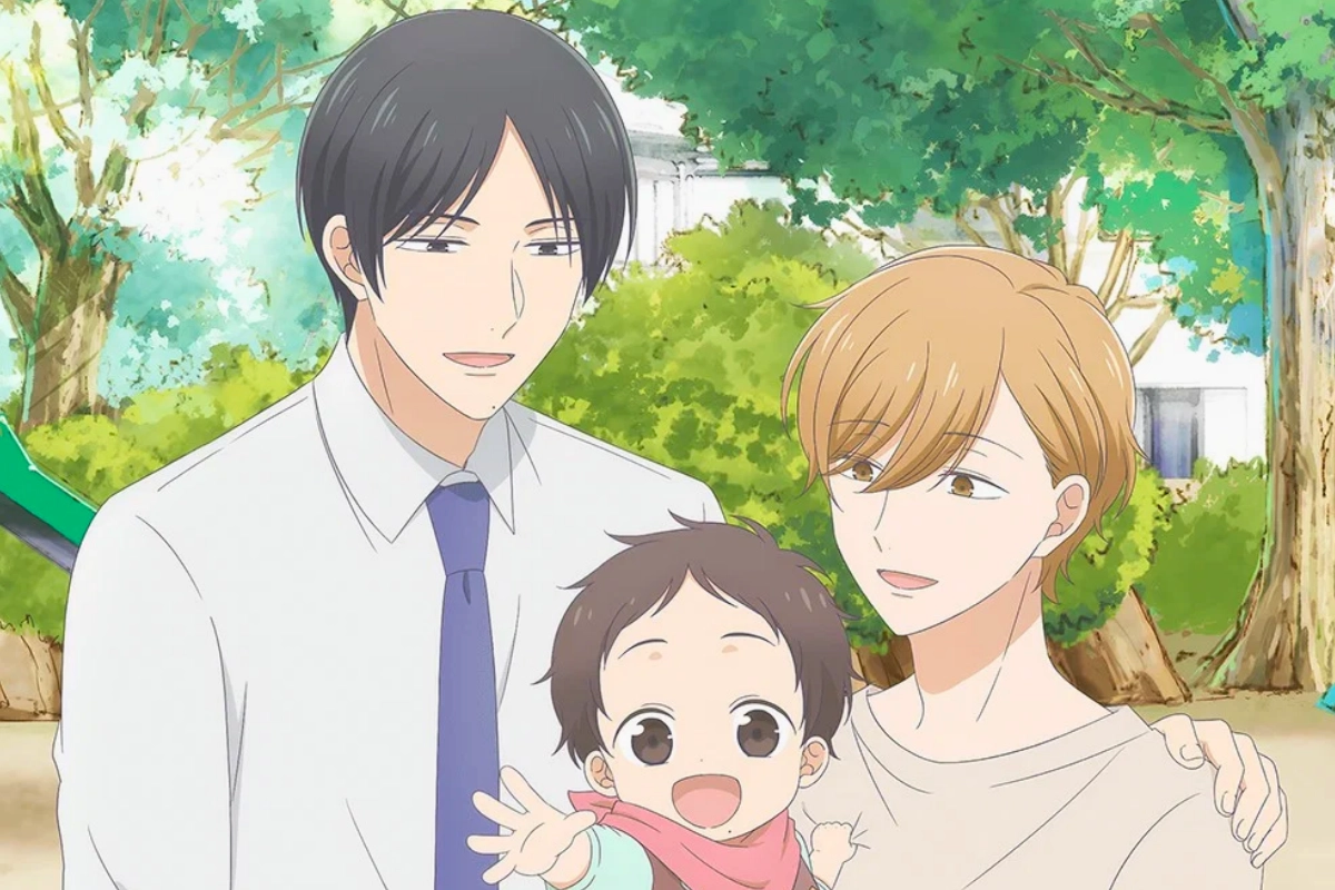 Two men stand closely together outdoors with a smiling baby between them, surrounded by leafy green trees.