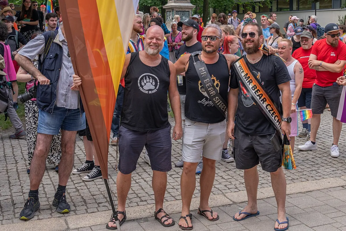 What Does GMPD Mean? Japanese Gay Body Types Explained 16 Three man stand among a crowd as they pose for a photo wearing ‘bear’ inspired clothing.