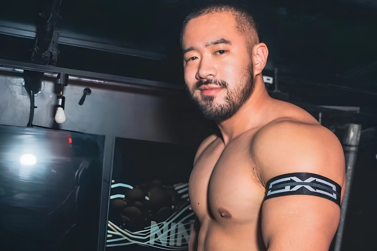 What Does GMPD Mean? Japanese Gay Body Types Explained 12 Male gogo boy with GMPD gacchiri body type smiles for photograph in gogo outfit, as they are about to get onto stage.