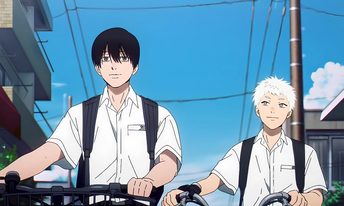 Yoshiki and Hikaru walk their bicycles along a quiet village street under a bright blue summer sky, both wearing white school shirts and backpacks.