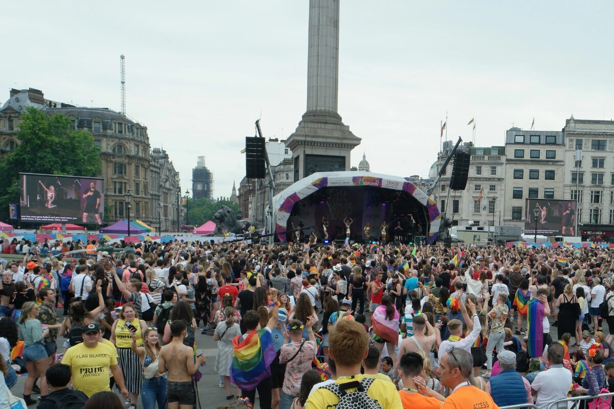 London Pride festival-goers watch a concert in Trafalgar Square. Nelson’s Column can be seen in the background