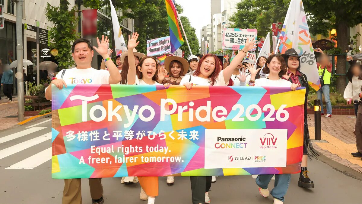 Marchers in the Tokyo Pride Parade 2026 wave towards the camera. At the front is a banner reading “Equal rights today. A freer, fairer tomorrow.”
