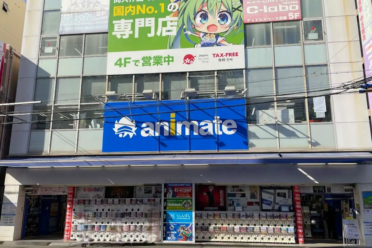 Where to Buy Yaoi/BL & Bara Manga in Japan 21 Exterior of an Animate store in Osaka, with a large blue Animate sign and anime advertisements above the entrance.