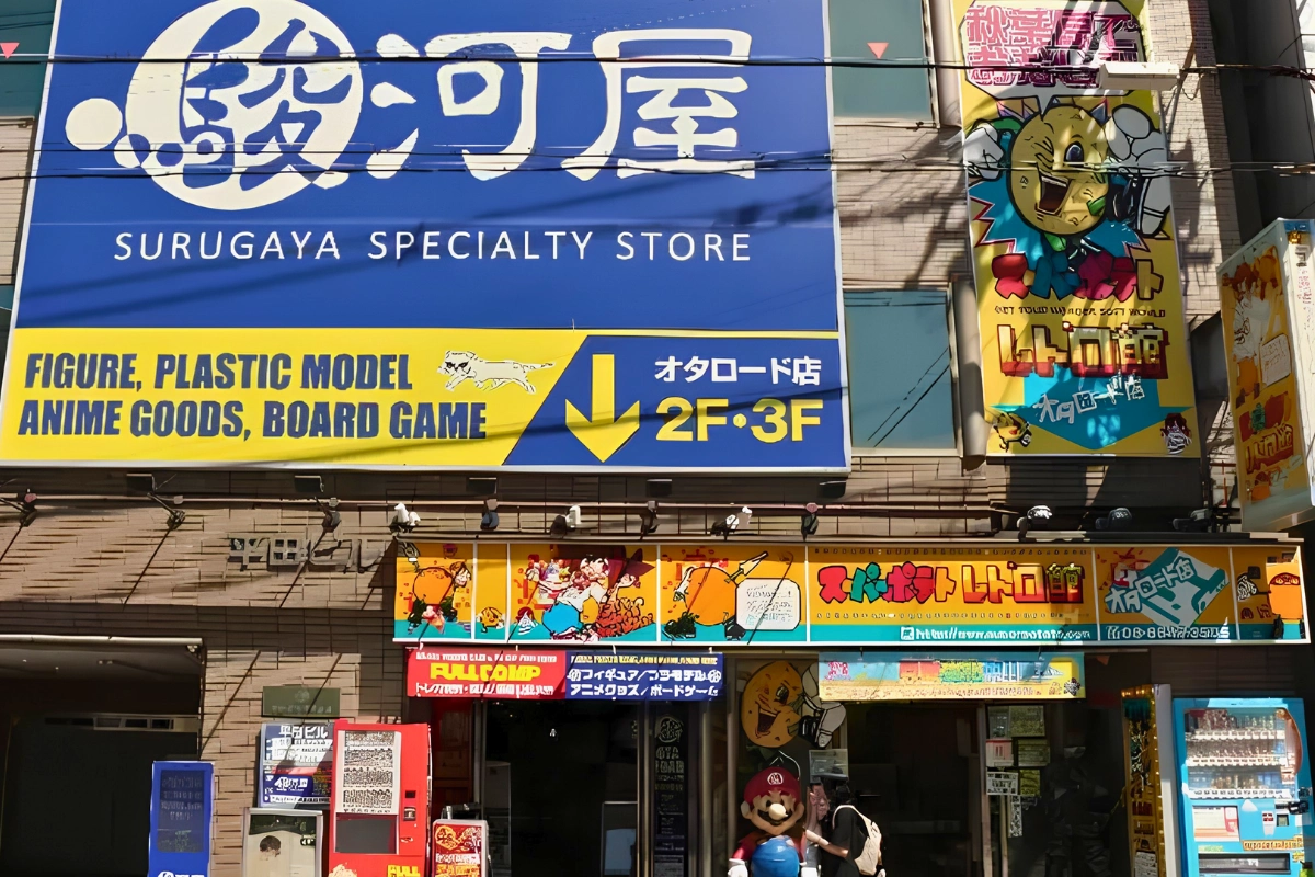Where to Buy Yaoi/BL & Bara Manga in Japan 22 Exterior of a Surugaya specialty store in Japan, with large signs advertising figures, plastic models, anime goods and board games.