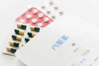 Patient prescription envelope with sachets of tablets inside.