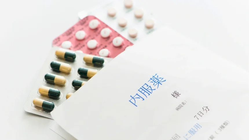 Patient prescription envelope with sachets of tablets inside.
