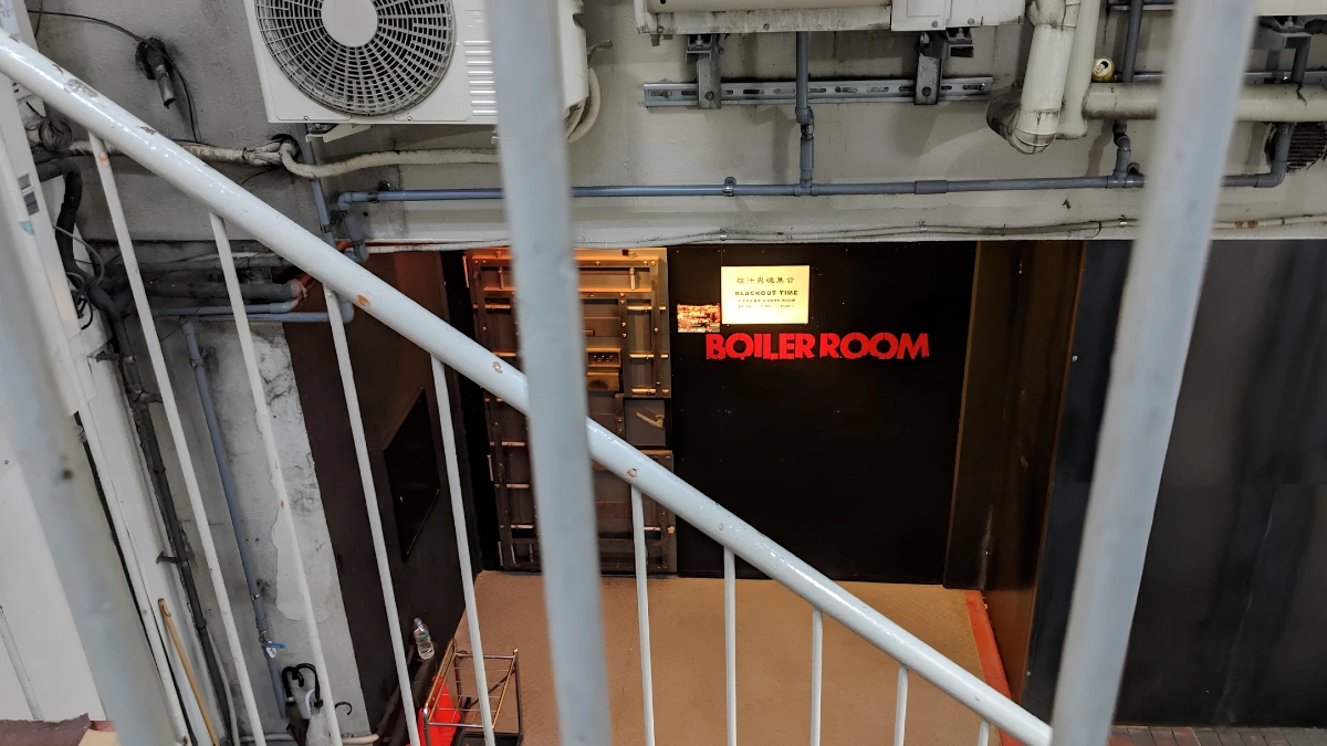 Image of entrance to Boiler Room in Nichome. Image is taken from the stairs down to the basement where entrance to Boiler Room is located.