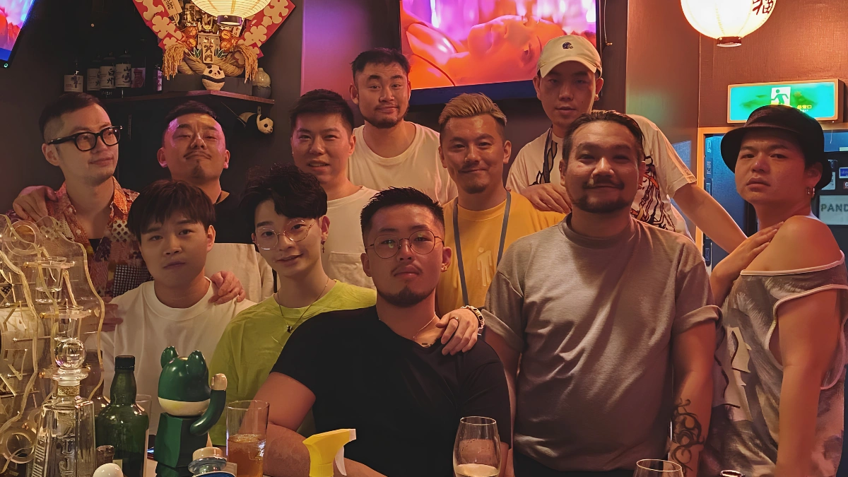 Staff and customers celebrating inside of Panda Bar