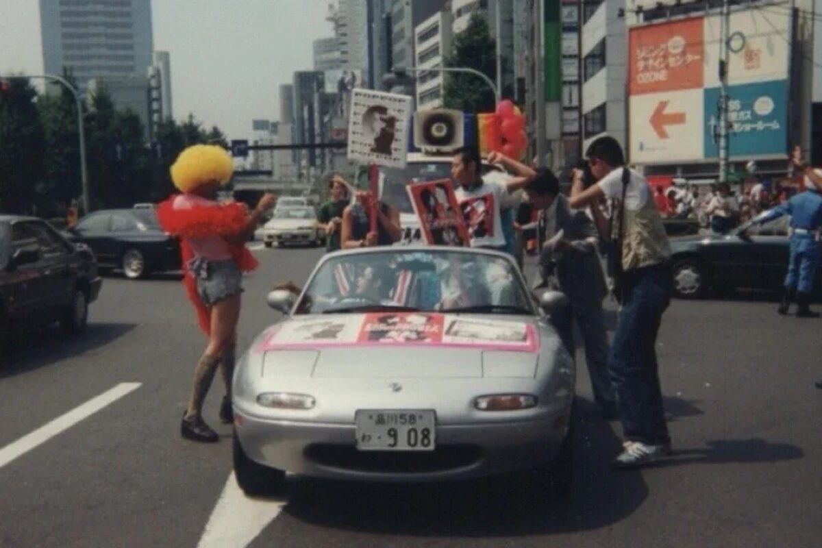 The History of Tokyo Pride: Protest, Party and Progress 13 An open top car driven by and surrounded by marchers at the 1994 Tokyo Lesbian & Gay Pride Parade