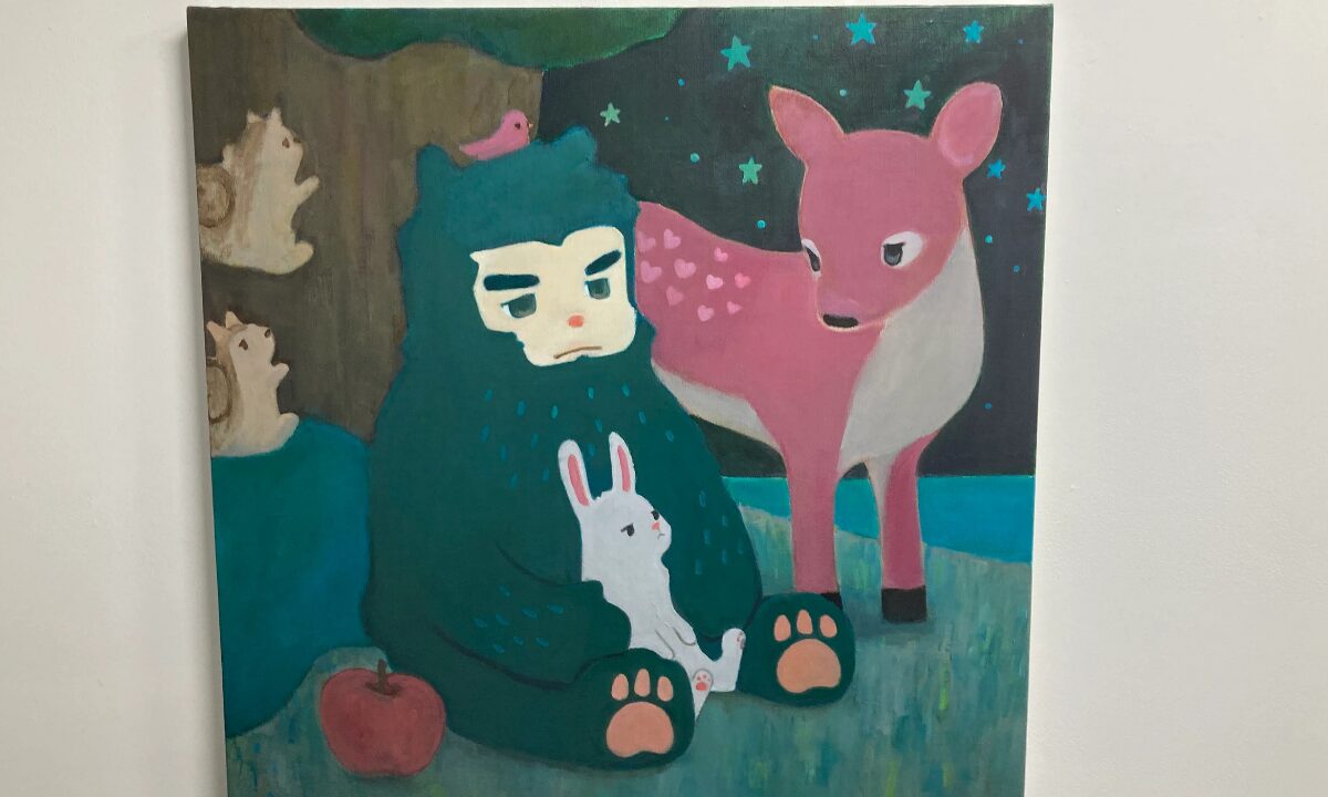 TORAJIRO’s “A Light That Never Goes Out”: Queer Masculinity, Vulnerability and Hope in Tokyo 11 A man, disguised as a bear, sits with a rabbit resting against him. A fawn, on the right, watches them from close by