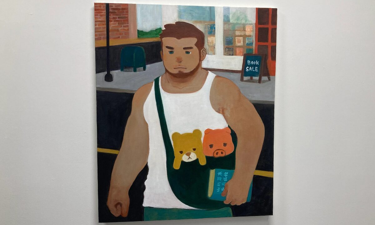 TORAJIRO’s “A Light That Never Goes Out”: Queer Masculinity, Vulnerability and Hope in Tokyo 13 A buff man, in a white vest, crosses the road away from a book shop. He is holding a book, and carrying a bag that contains a pig and a tiger