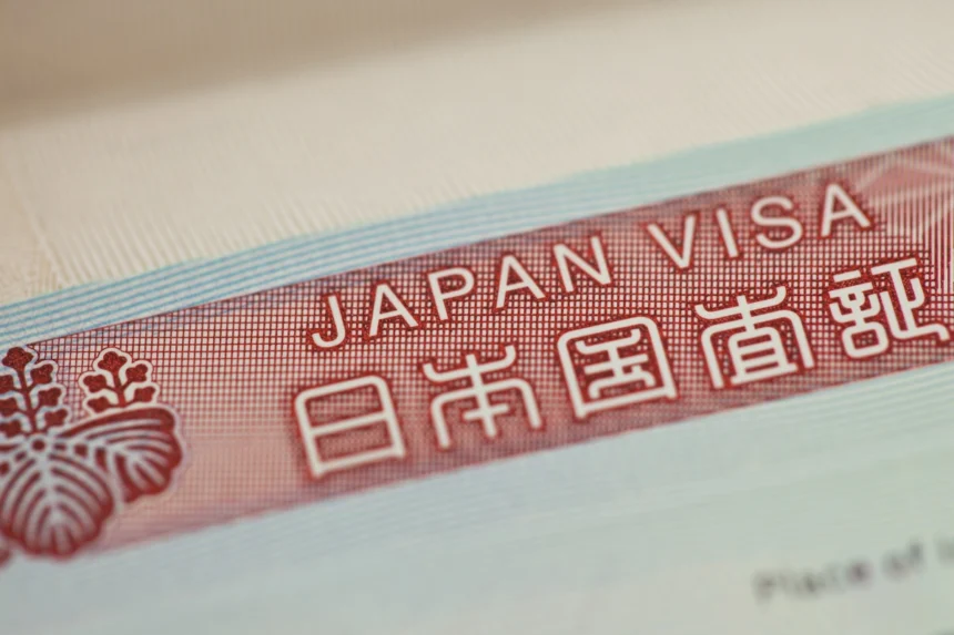 A Japanese visa documented with the kanji below and official emblem to the left