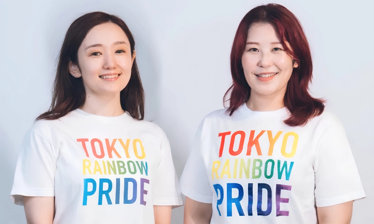 The History of Tokyo Pride: Protest, Party and Progress 19 Tokyo Rainbow Pride executive committee co-chairs Natsumi Yamada, left, and Yuko Sato smile to the camera, wearing matching Tokyo Rainbow Pride t-shirts