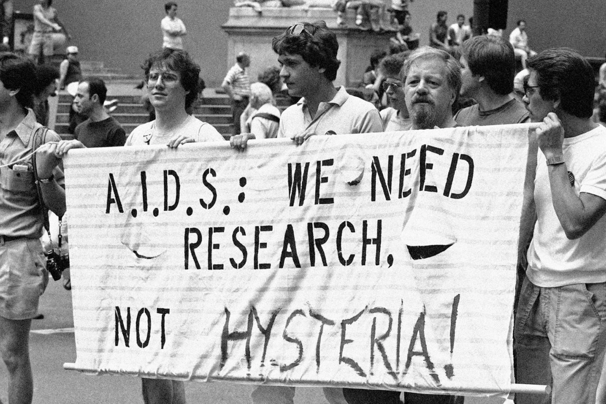 In Memoriam: Dr. Masayoshi Negishi, Pioneer of AIDS Treatment in Japan 12 AIDS activists hold a banner reading “A.I.D.S.: We need research, not hysteria!” during a public demonstration.